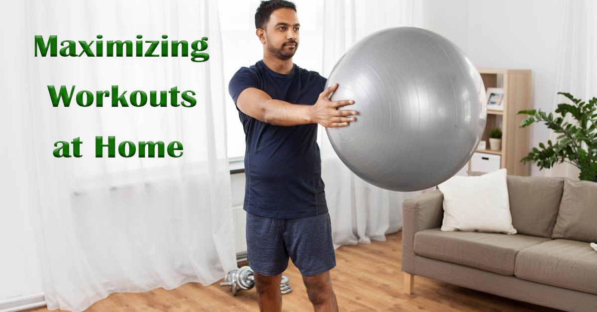 Safely Maximizing Solo Workouts at Home: Top Tips for Fitness Enthusiasts. Picture of a young Indian male exercising at home with a large ball.