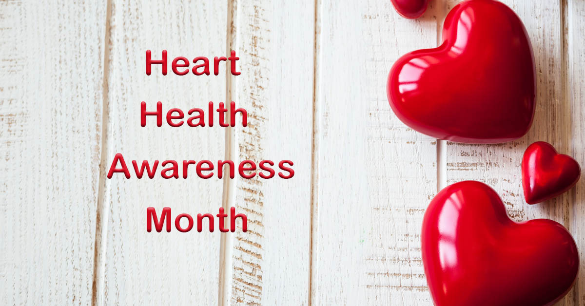 February is American Heart Month. Picture of red heart shaped bubbles laying on a piece of light colored paneling.