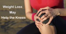 Take a Load Off of Your Knees. Picture of a young caucasian female sitting and holding onto her knee.