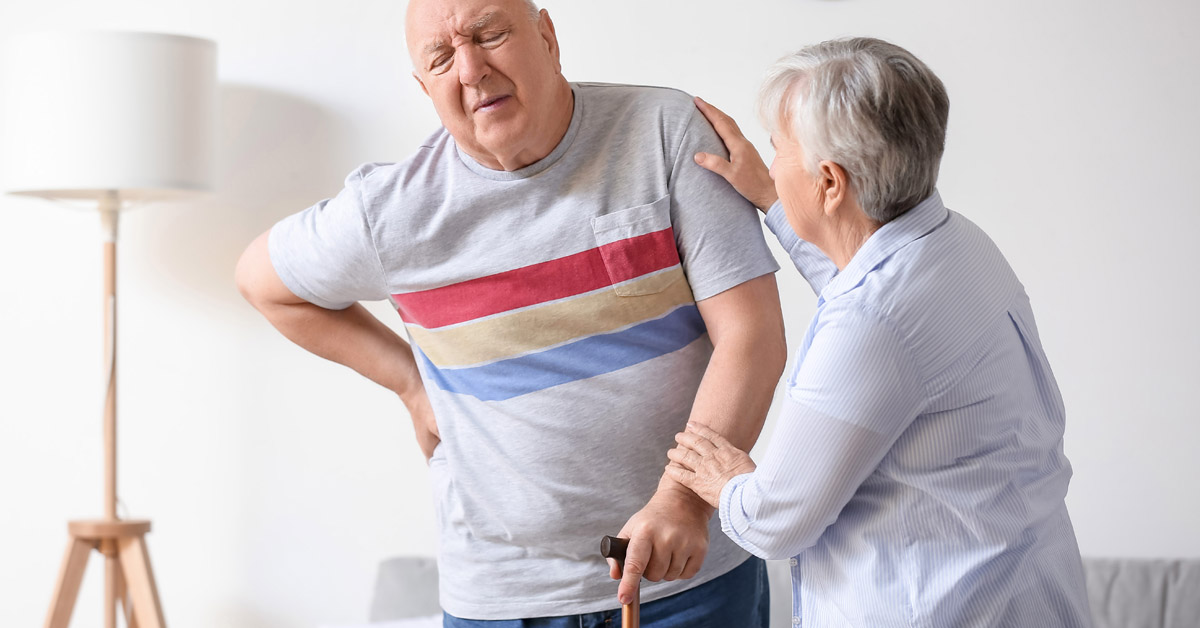 Senior man complaining of back pain.